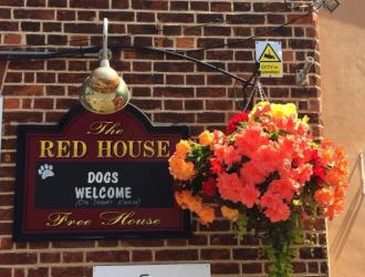 Red House wall plaque with orange hanging basket